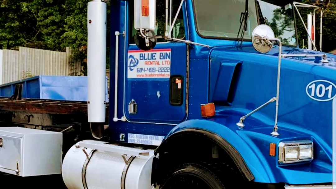 Blue Bin Rental truck with company branding